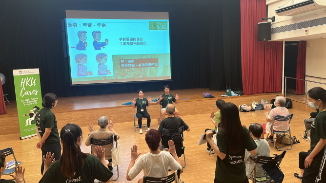 The student ambassadors lead a group of elderlies from the Pokfulam community to conduct warm-up exercises.  